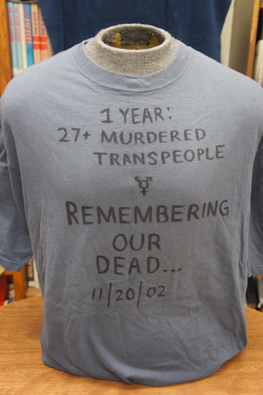 the front of a grey t-shirt with handwritten text