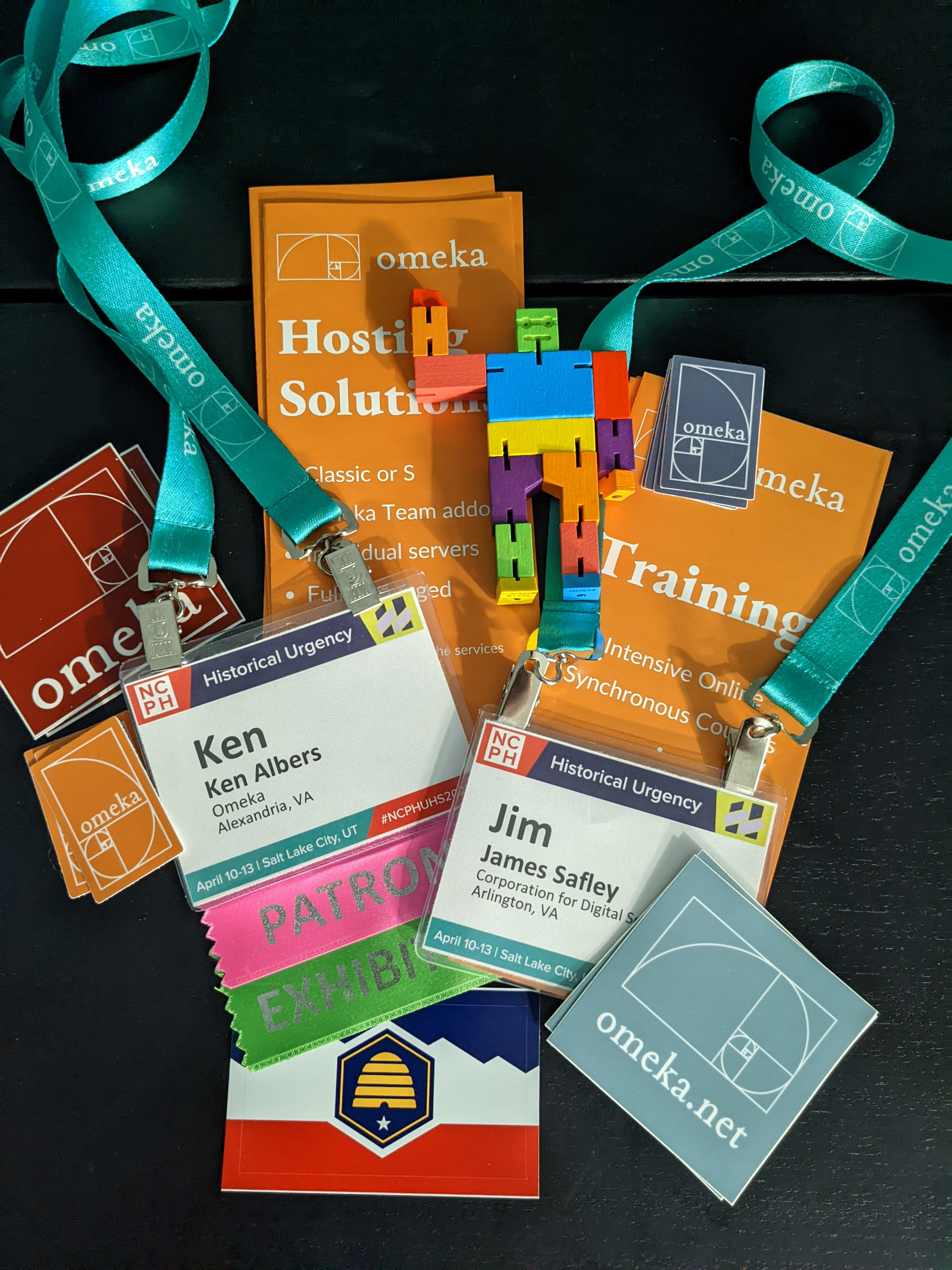 Omeka swag and name badges from the Team's visit to NCPH 2024 in Salt Lake City.